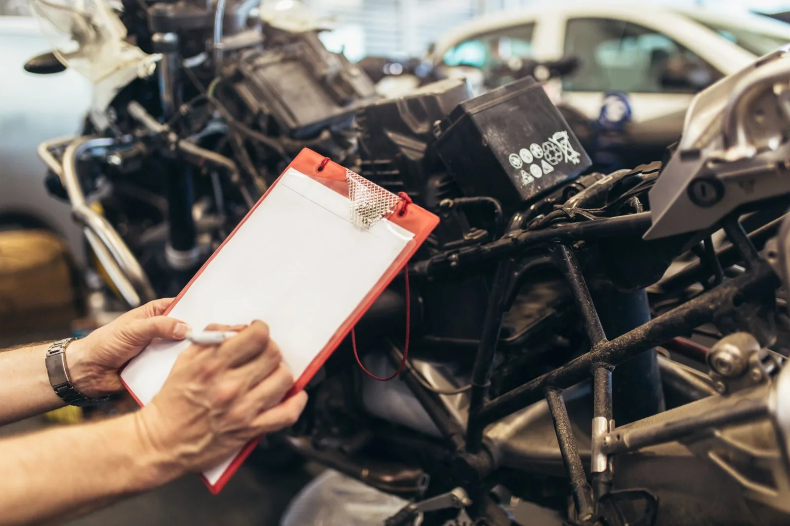 Motorcycle inspection close-up in the shop